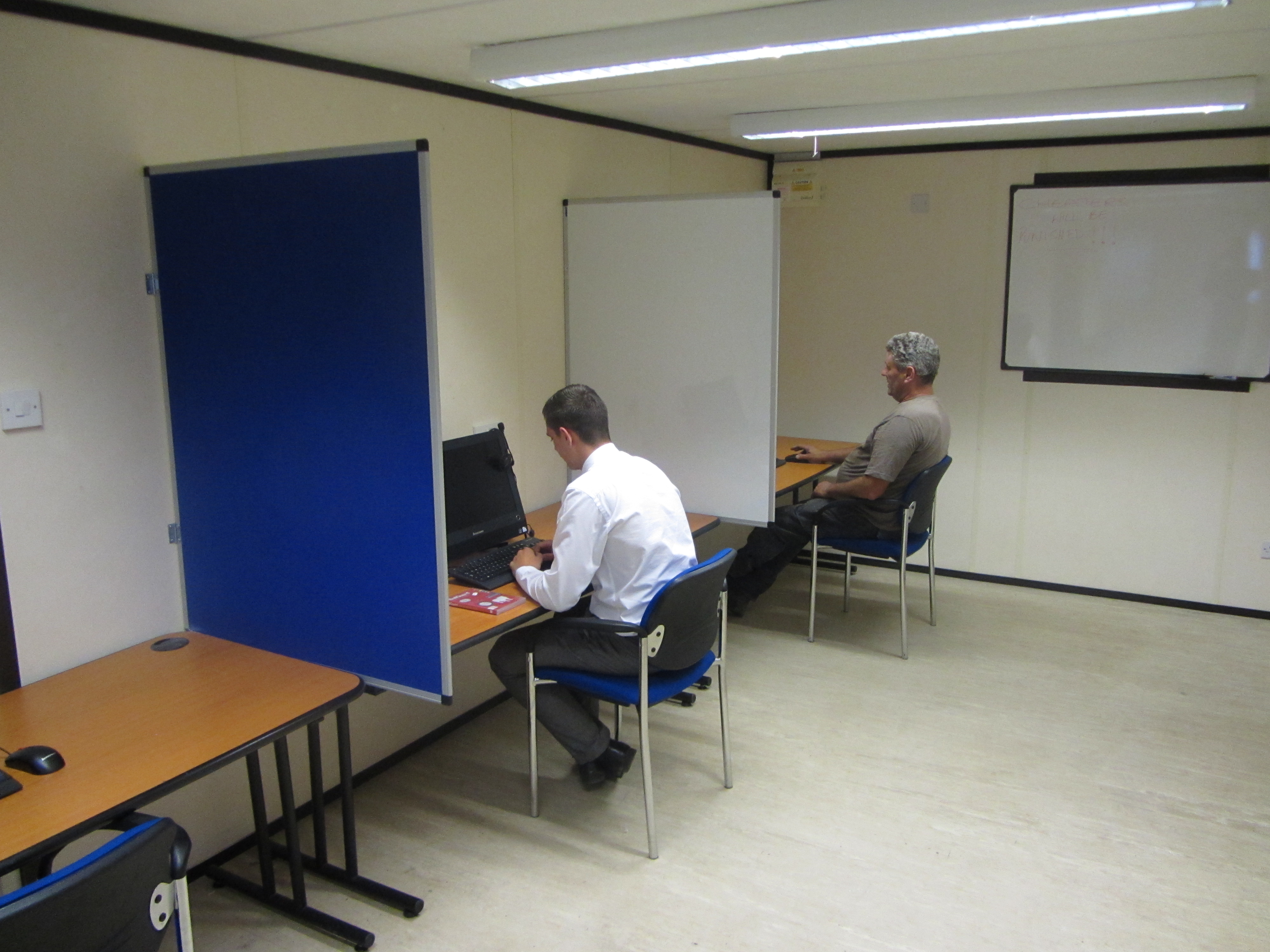 workers in cscs testing room